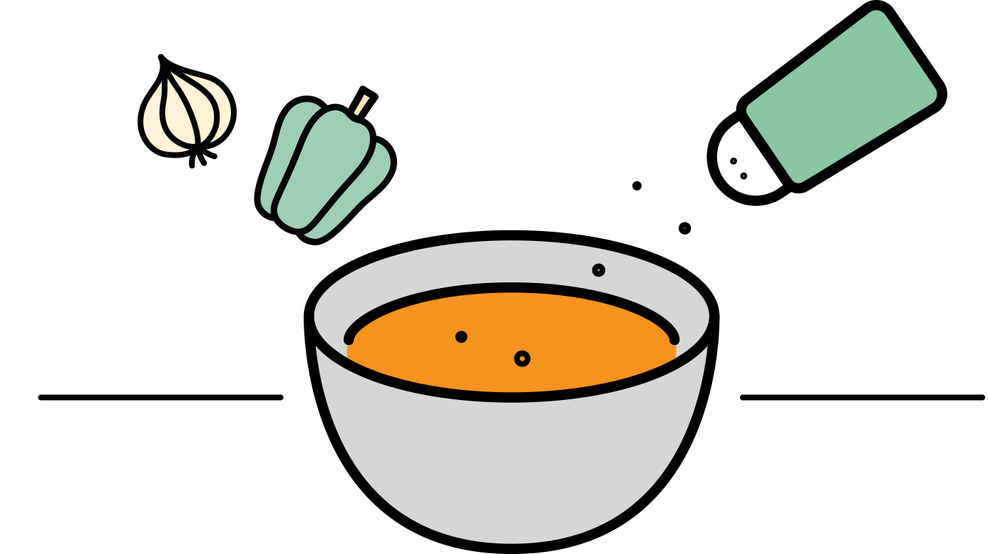 Schüssel mit Suppe, die gerade gewürzt wird